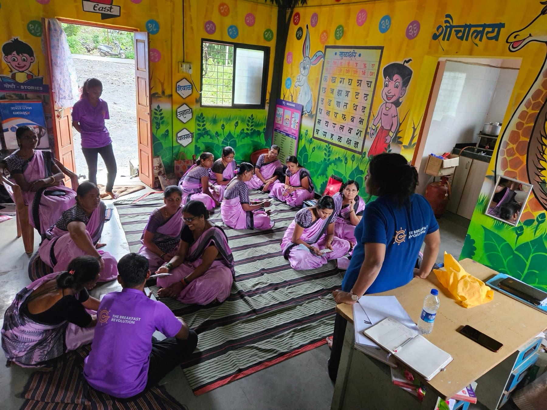 A row of schoolchildren lined up together during a programme visit.